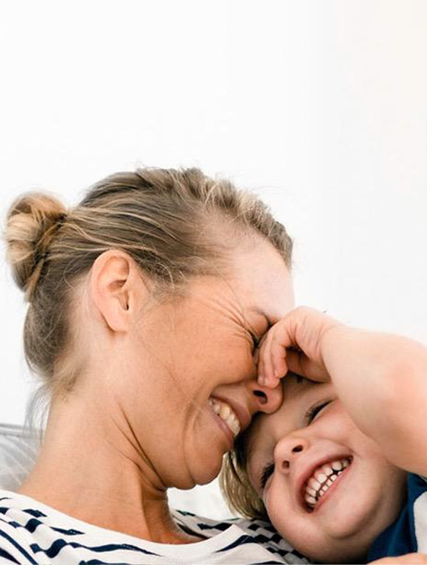 Mom and child smiling